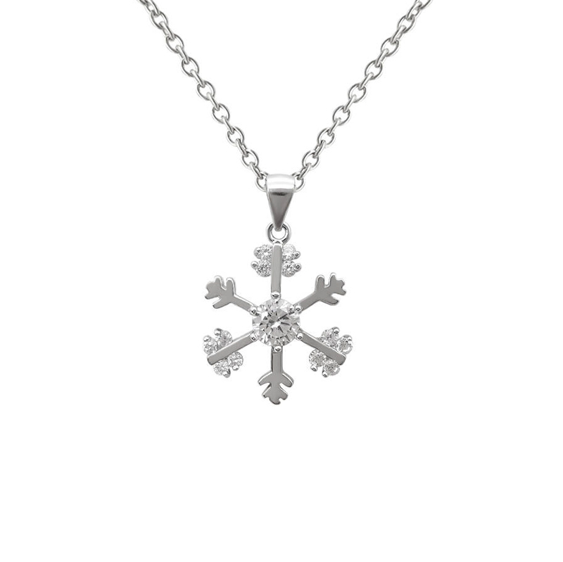 Pendentif Flocon de neige Copenhague en argent 925 avec des zircons transparents modèle by White Alpina. Livré dans un écrin avec une chaîne