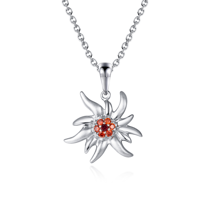 Pendentif Edelweiss Petra en argent 925 mâte et brillant avec zircons orange et grenat modèle by White Alpina. Découvrez Notre collier Edelweiss.